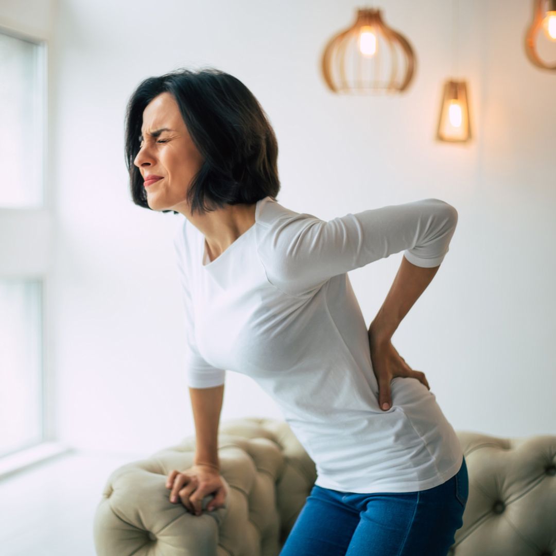 Woman experiencing lower back pain