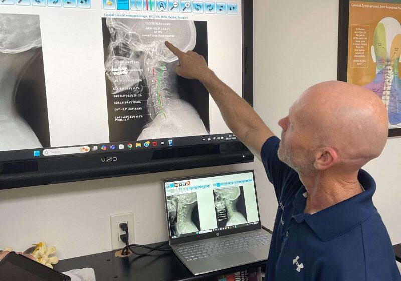 Dr. Wills observing x-ray scan of client